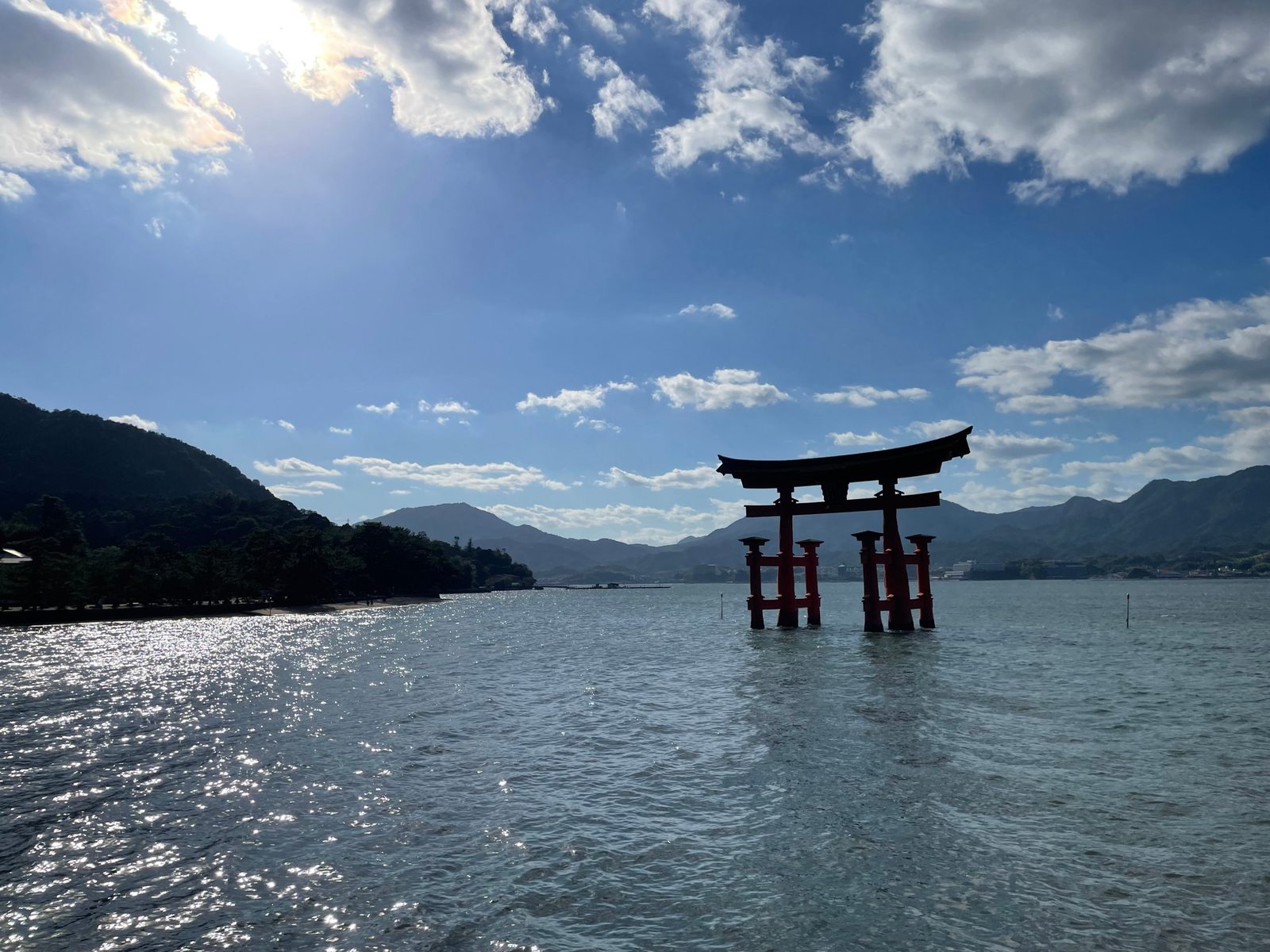 The torii gate of Itsukushima Shrine standing in the sea on Miyajima