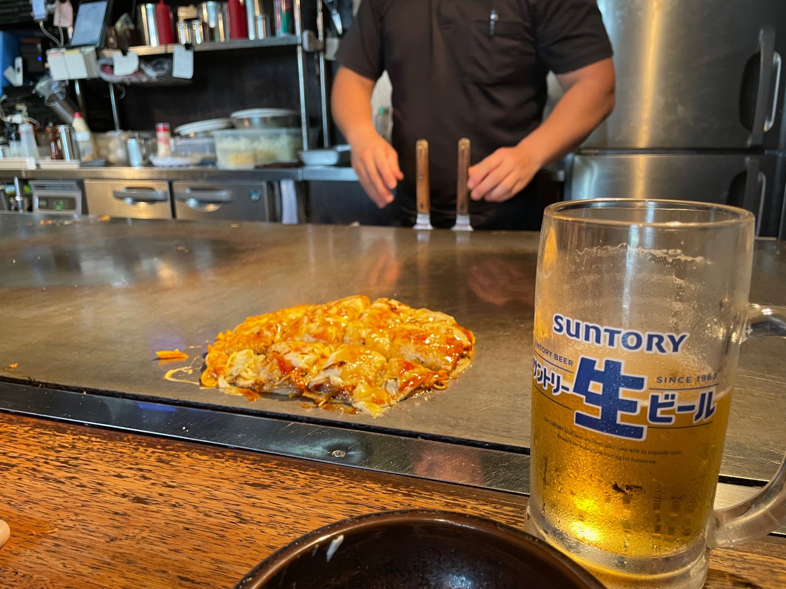 Finished okonomiyaki on the griddle
